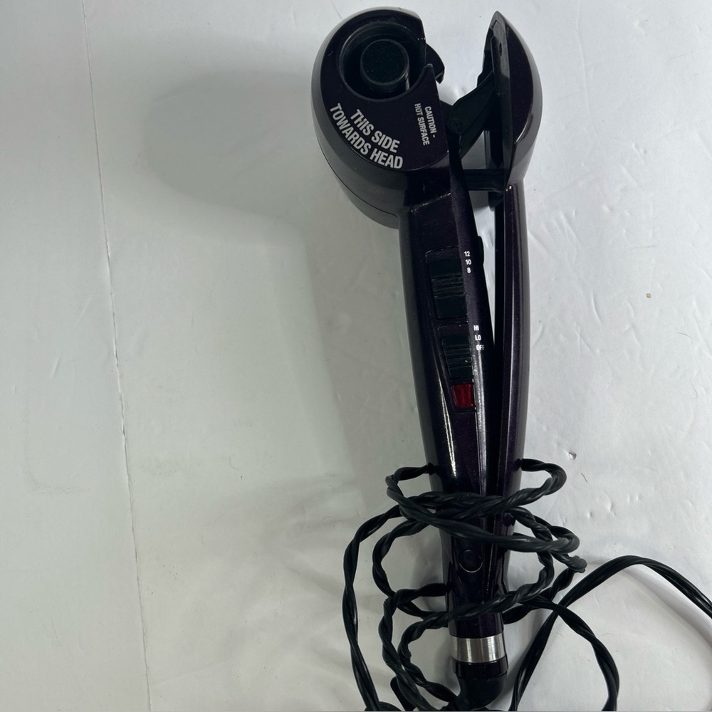 Infinity pro curling iron curls hair with push of button purple